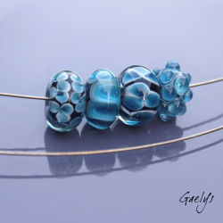 Lampwork Beads - Set of 4 blue ink beads on a black or ink background - featuring flowers, dots, and bubbles