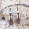 Elenah – earrings in glazed ceramic, ivory, hammered and enameled copper, and feather.