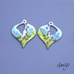 Pair of enameled copper earring charms – green and sky-blue background – foliage, purple flower, periwinkle blue