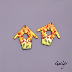 Pair of enameled copper earring charms – yellow, orange, and green background – birdhouse – foliage, multicolored