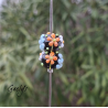 Perles Lampwork à fleurs - duo de perles rondelle 4 fleurs  - fond noir / fleurs bleues, oranges, blanches