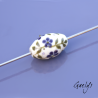 Pearl ivory background with olive green foliage and purple flowers